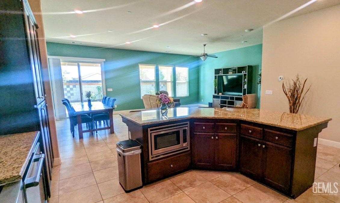 Undisclosed Address Shafter, CA 93263 - Photo 6 of 31 a kitchen with a sink stove and cabinets