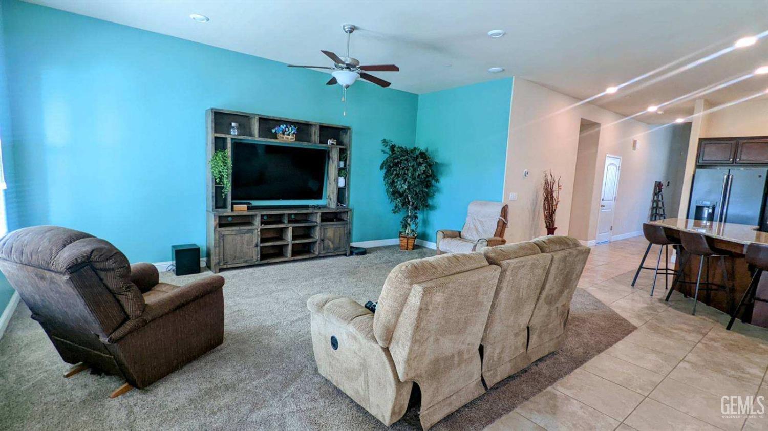 Undisclosed Address Shafter, CA 93263 - Photo 10 of 31 a living room with furniture and a flat screen tv