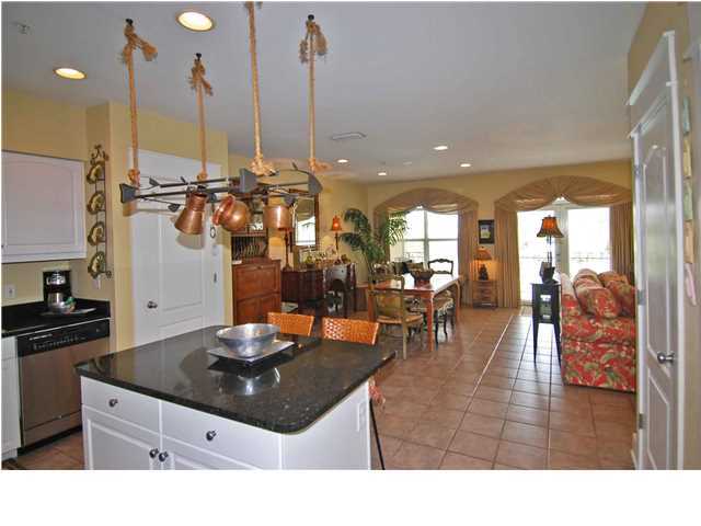 B302 Seacrest Blvd Inlet Beach, Unit B302 Inlet Beach, FL 32461 - Photo 11 of 19 a living room with furniture a large window and a dining table