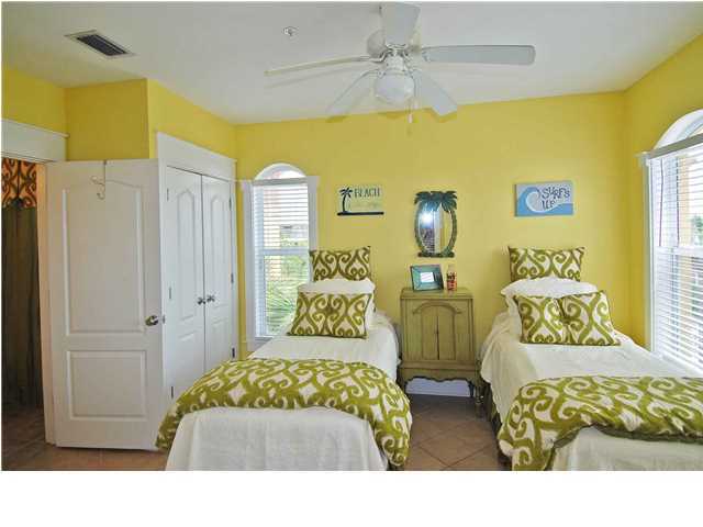 B302 Seacrest Blvd Inlet Beach, Unit B302 Inlet Beach, FL 32461 - Photo 3 of 19 a bedroom with a bed and wooden floor