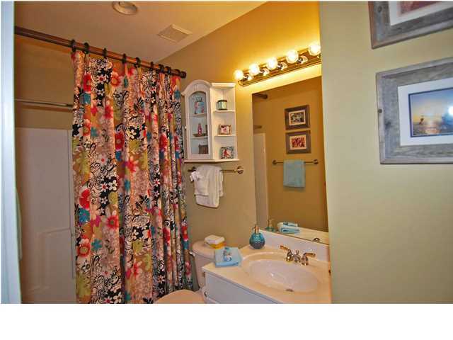 B302 Seacrest Blvd Inlet Beach, Unit B302 Inlet Beach, FL 32461 - Photo 6 of 19 a bathroom with a sink and a mirror