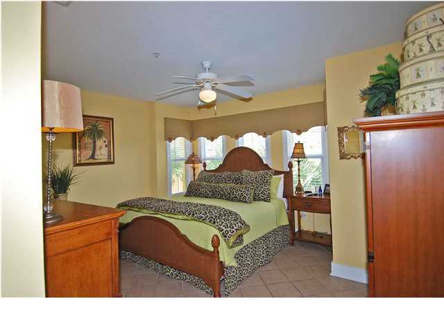 B302 Seacrest Blvd Inlet Beach, Unit B302 Inlet Beach, FL 32461 - Photo 7 of 19 a bedroom with a bed and a chandelier