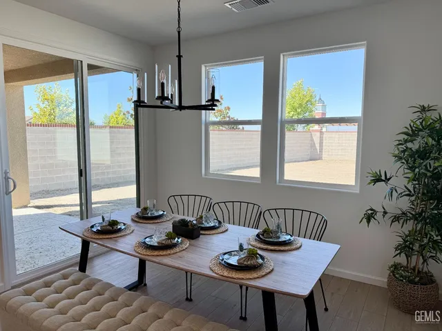 a view of a dining room with furniture window and outside view