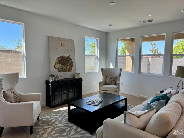 a living room with furniture and a window