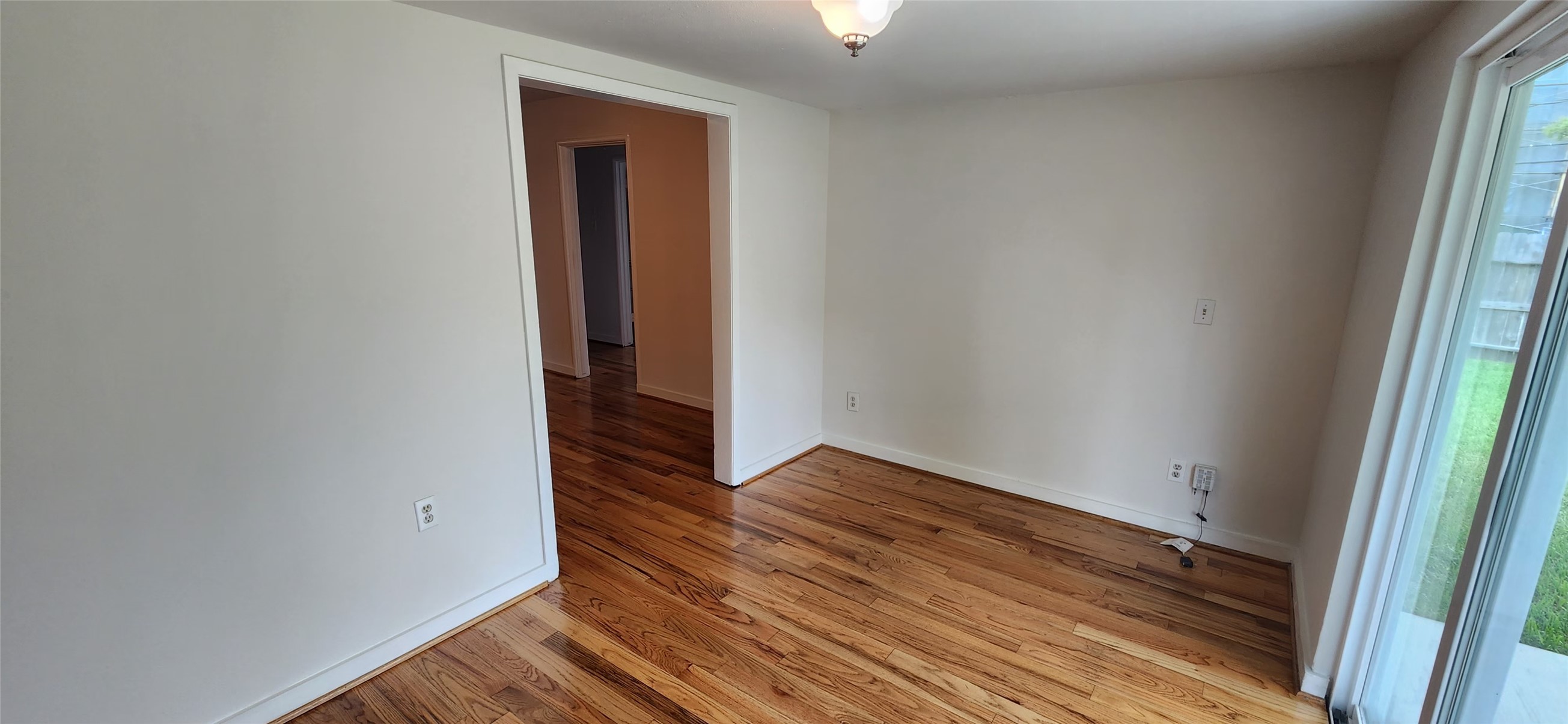 5501 Huisache Street Houston, TX 77081 - Photo 15 of 15 an empty room with wooden floor and closet