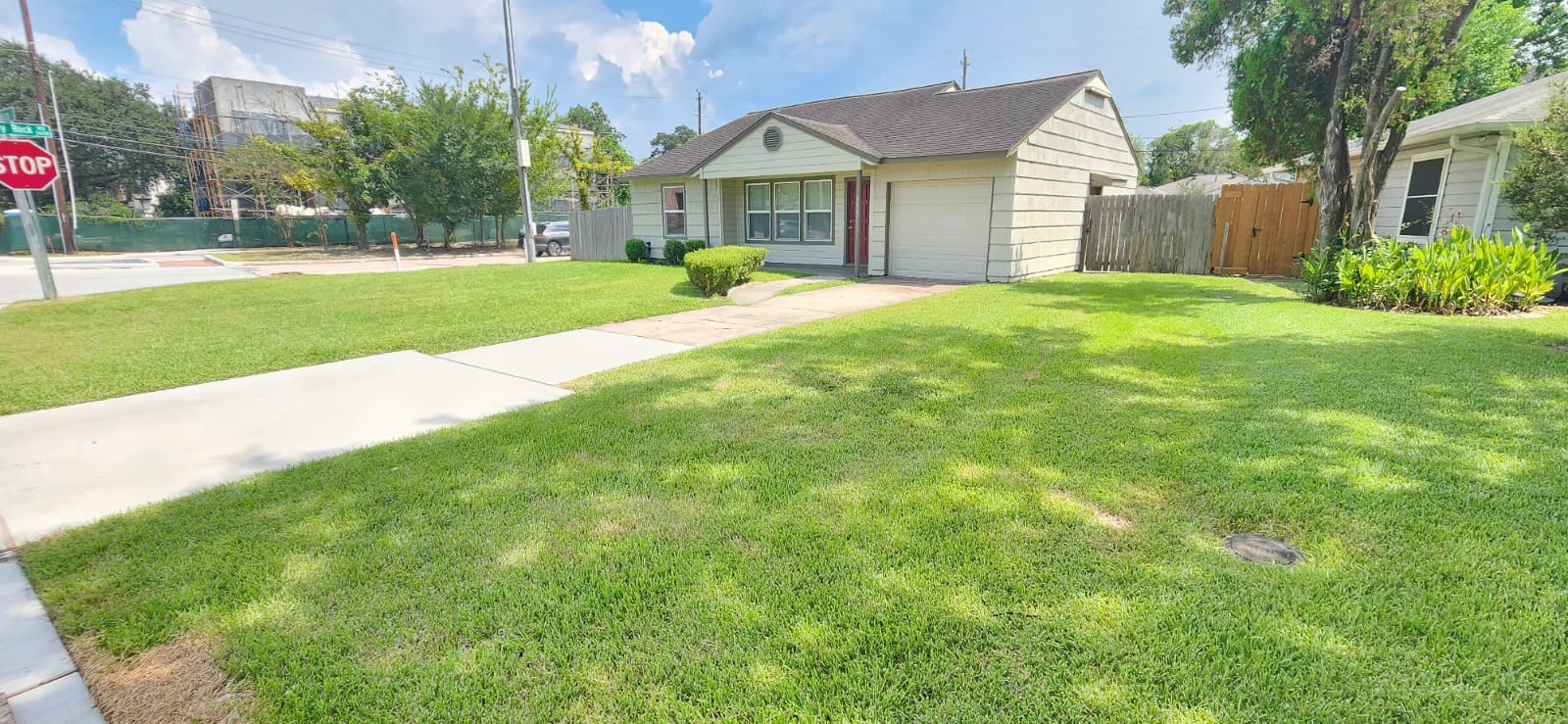 5501 Huisache Street Houston, TX 77081 - Photo 2 of 15 a view of a house with a yard and large tree