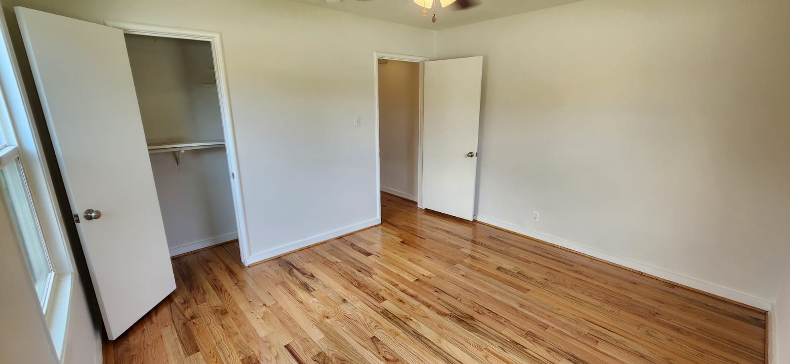5501 Huisache Street Houston, TX 77081 - Photo 5 of 15 a view of empty room with wooden floor