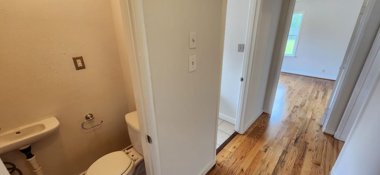 5501 Huisache Street Houston, TX 77081 - Photo 8 of 15 a white toilet sitting next to a bathroom sink