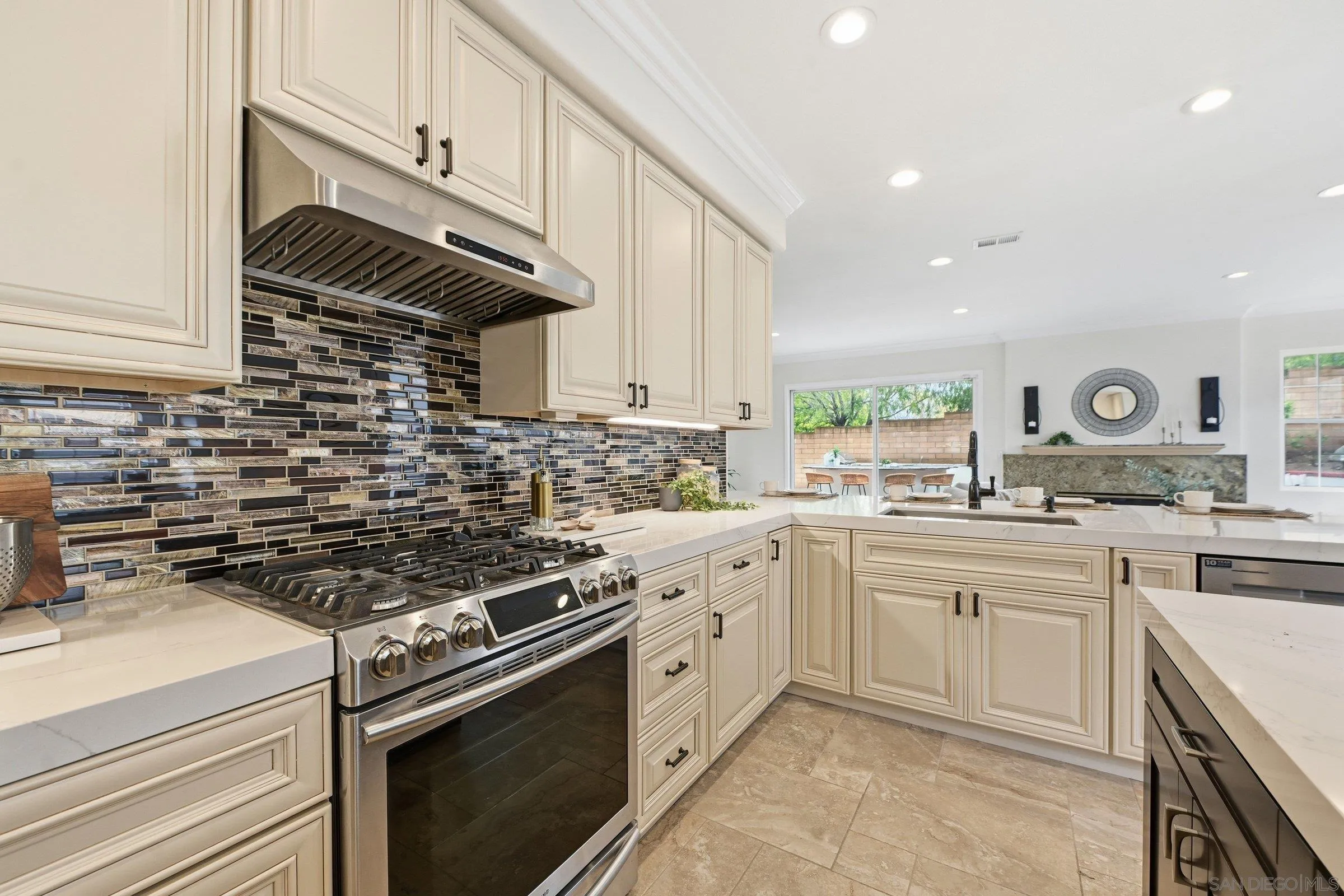 12632 Footman Lane Poway, CA 92064 - Photo 23 of 48 a kitchen with cabinets stainless steel appliances and a sink