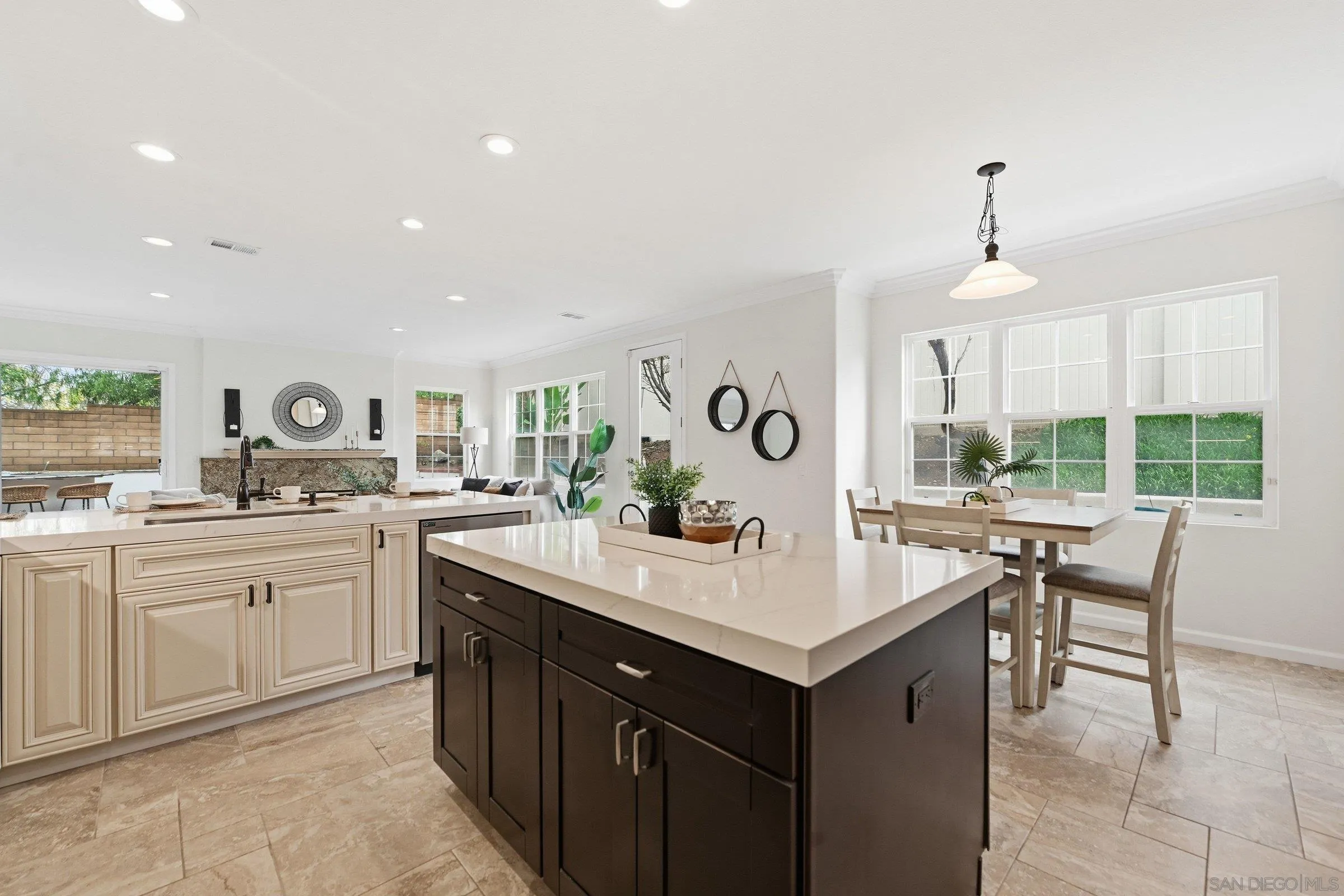 12632 Footman Lane Poway, CA 92064 - Photo 24 of 48 a kitchen with a sink window and chairs