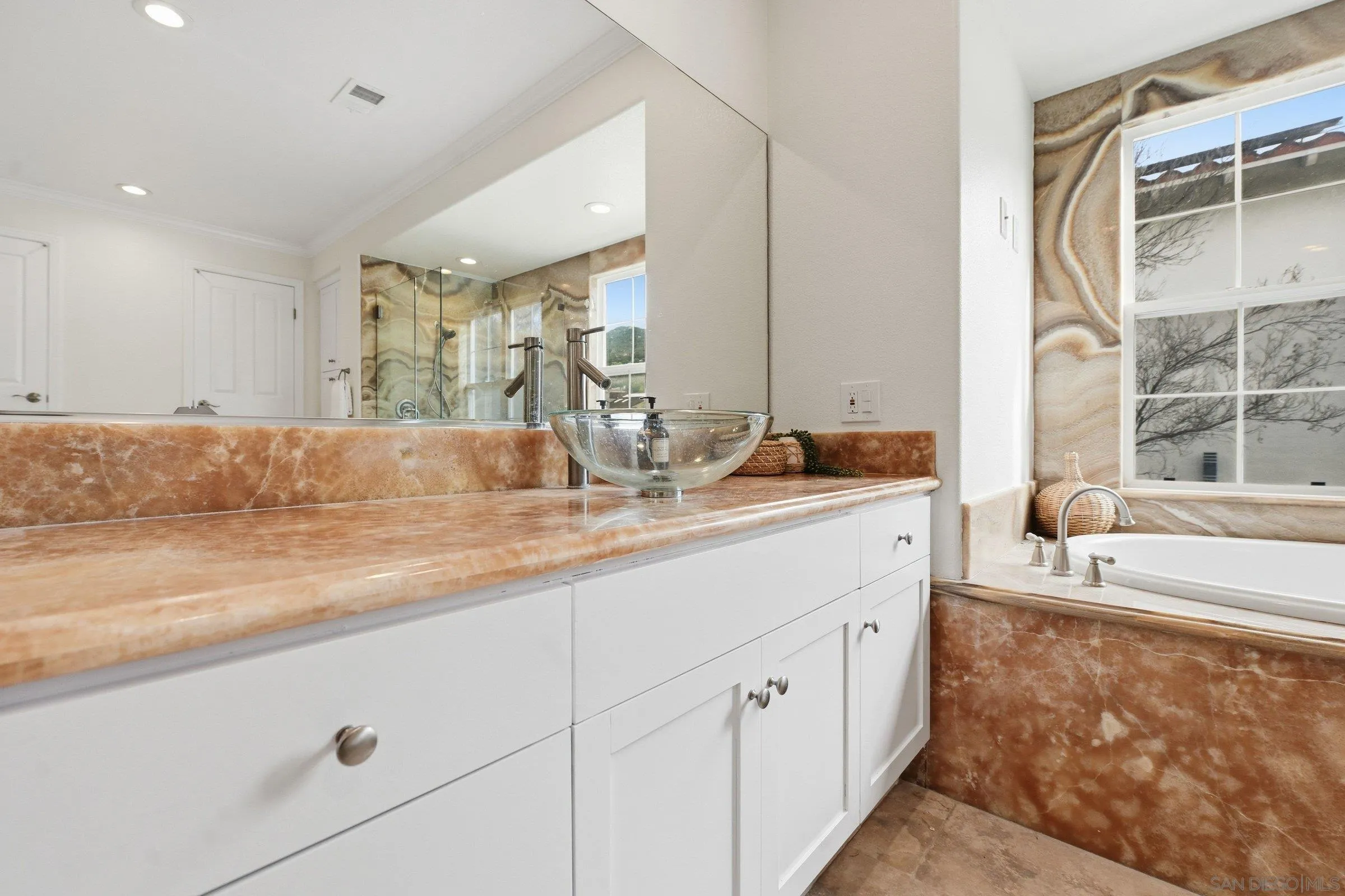 12632 Footman Lane Poway, CA 92064 - Photo 33 of 48 a bathroom with a double vanity sink and mirror