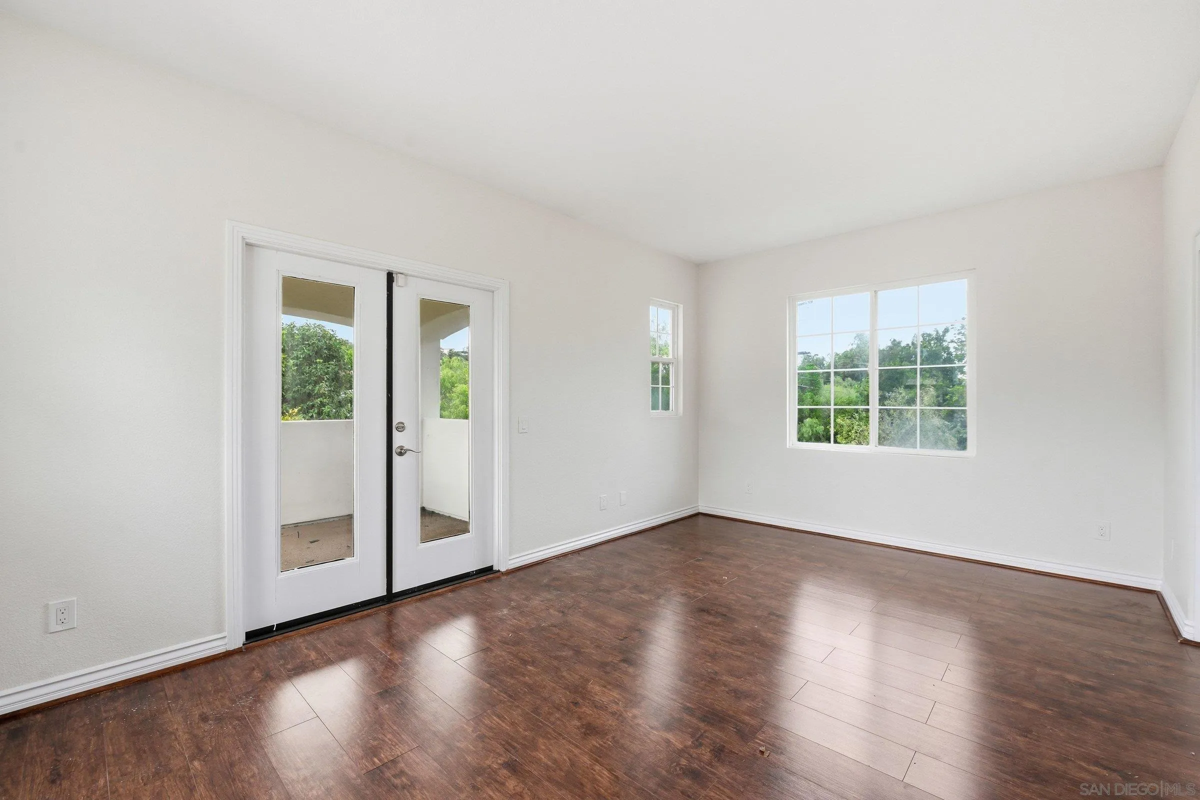 12632 Footman Lane Poway, CA 92064 - Photo 40 of 48 an empty room with wooden floor and windows