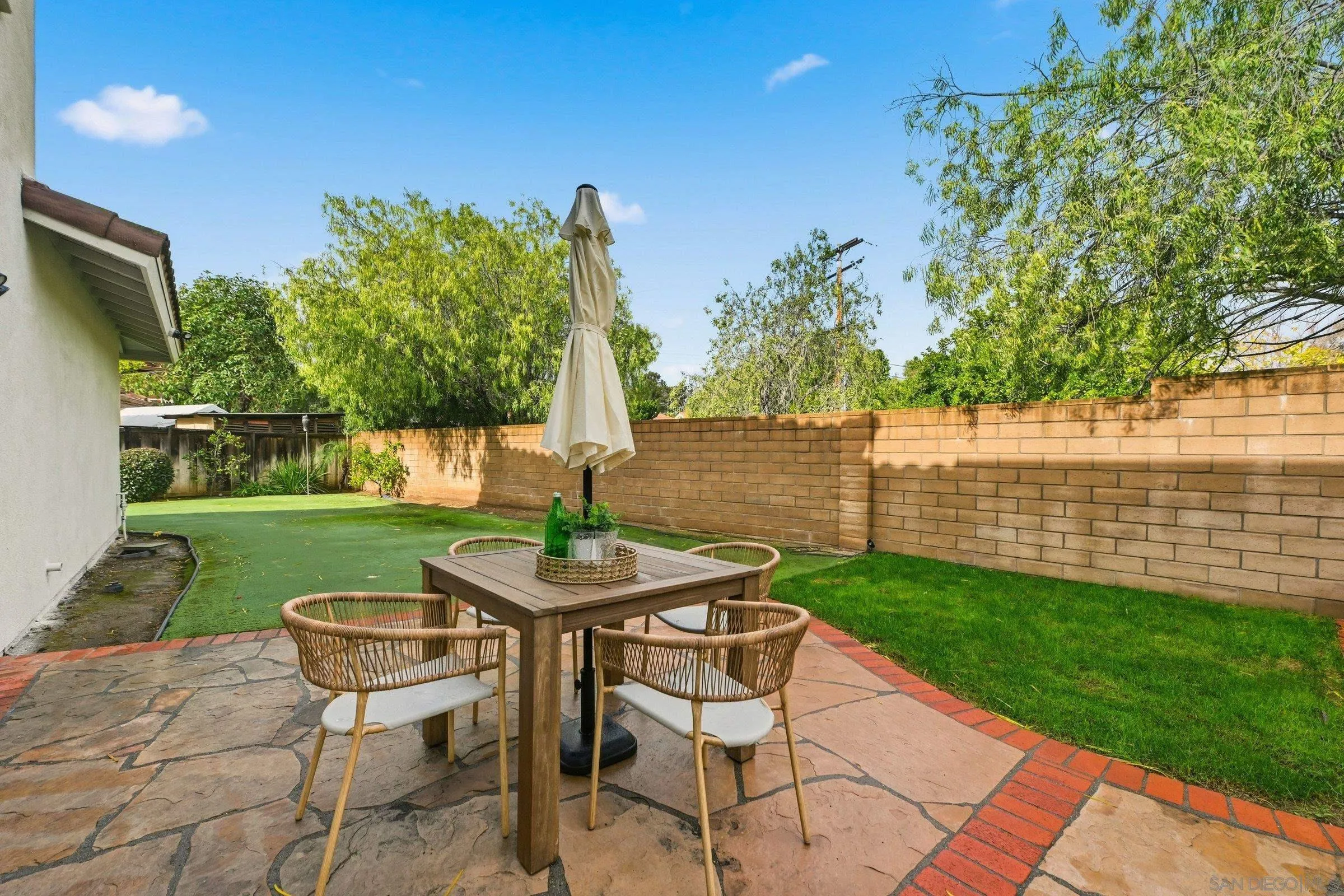 12632 Footman Lane Poway, CA 92064 - Photo 46 of 48 a view of a table and chairs in the garden