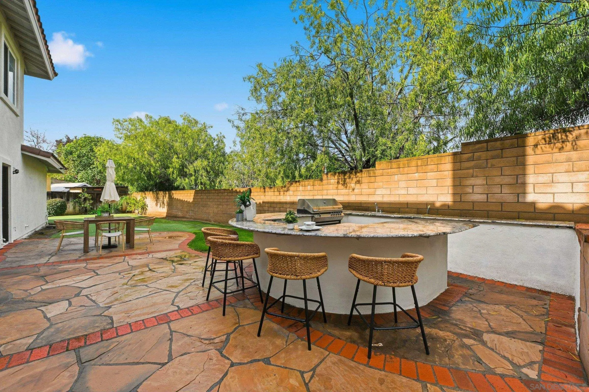 12632 Footman Lane Poway, CA 92064 - Photo 5 of 48 a backyard of a house with table and chairs