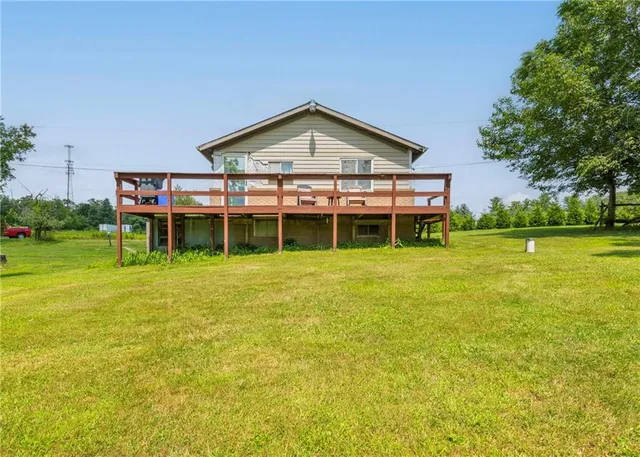 a front view of house with yard and green space