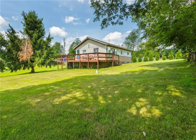 a view of balcony with wooden floor and seating space
