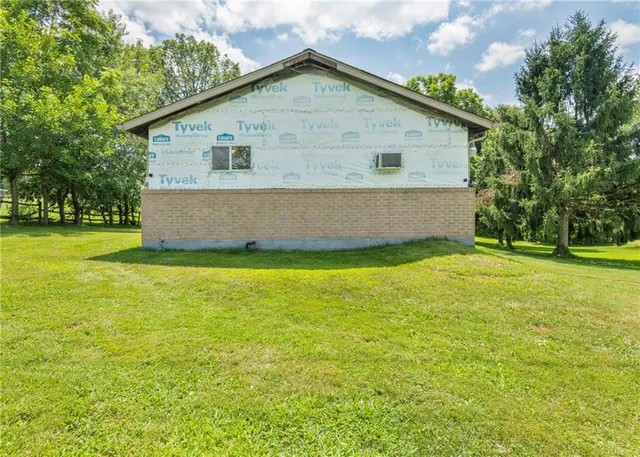 a view of a house with a big yard