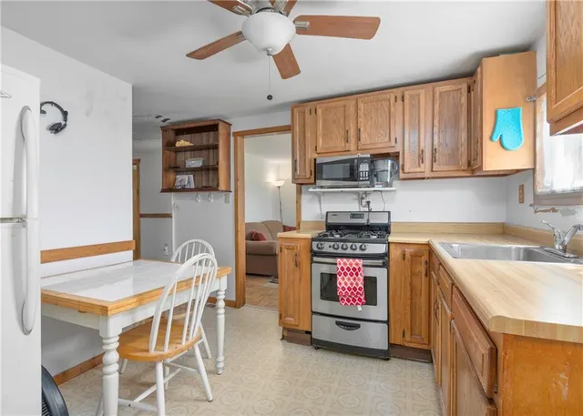 a room with lots of clutter and cabinets