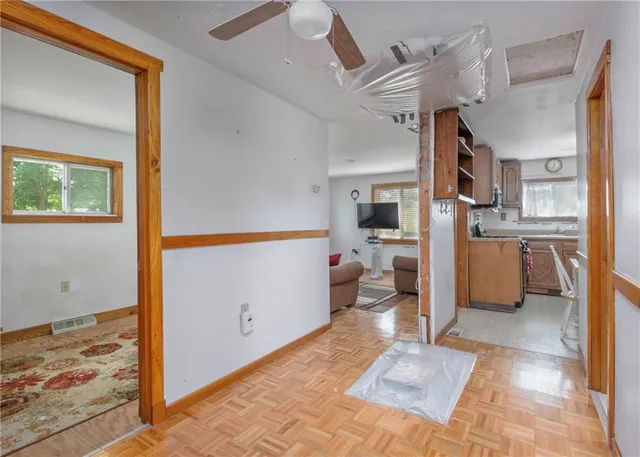 a view of empty room with wooden ceiling