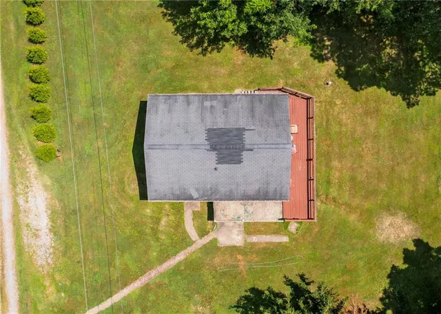 swimming pool view with a garden