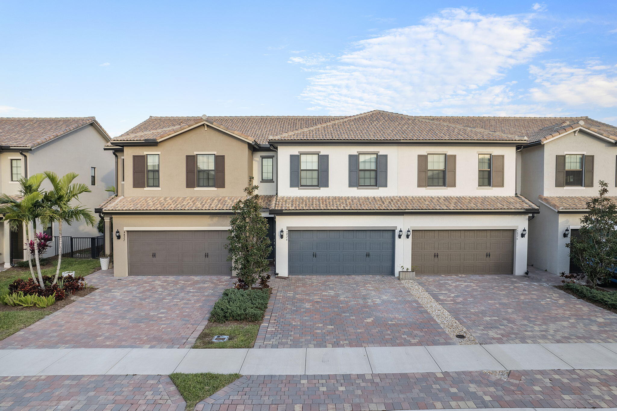 4824 Jumping Way Lake Worth, FL 33467 - Photo 1 of 40 a front view of a house with a yard and garage