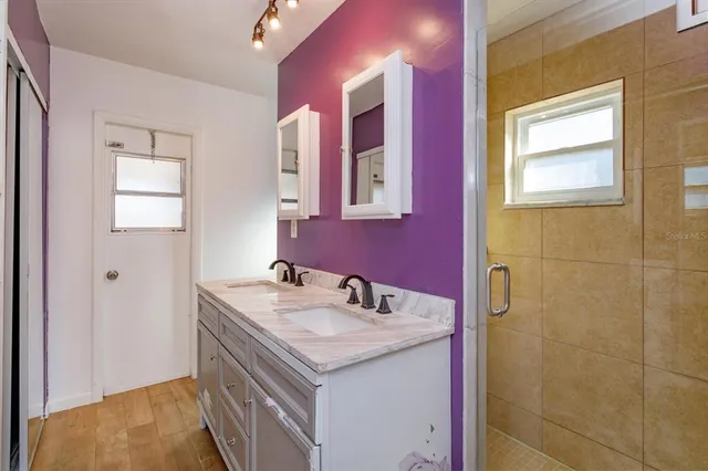 a bathroom with a sink and a mirror