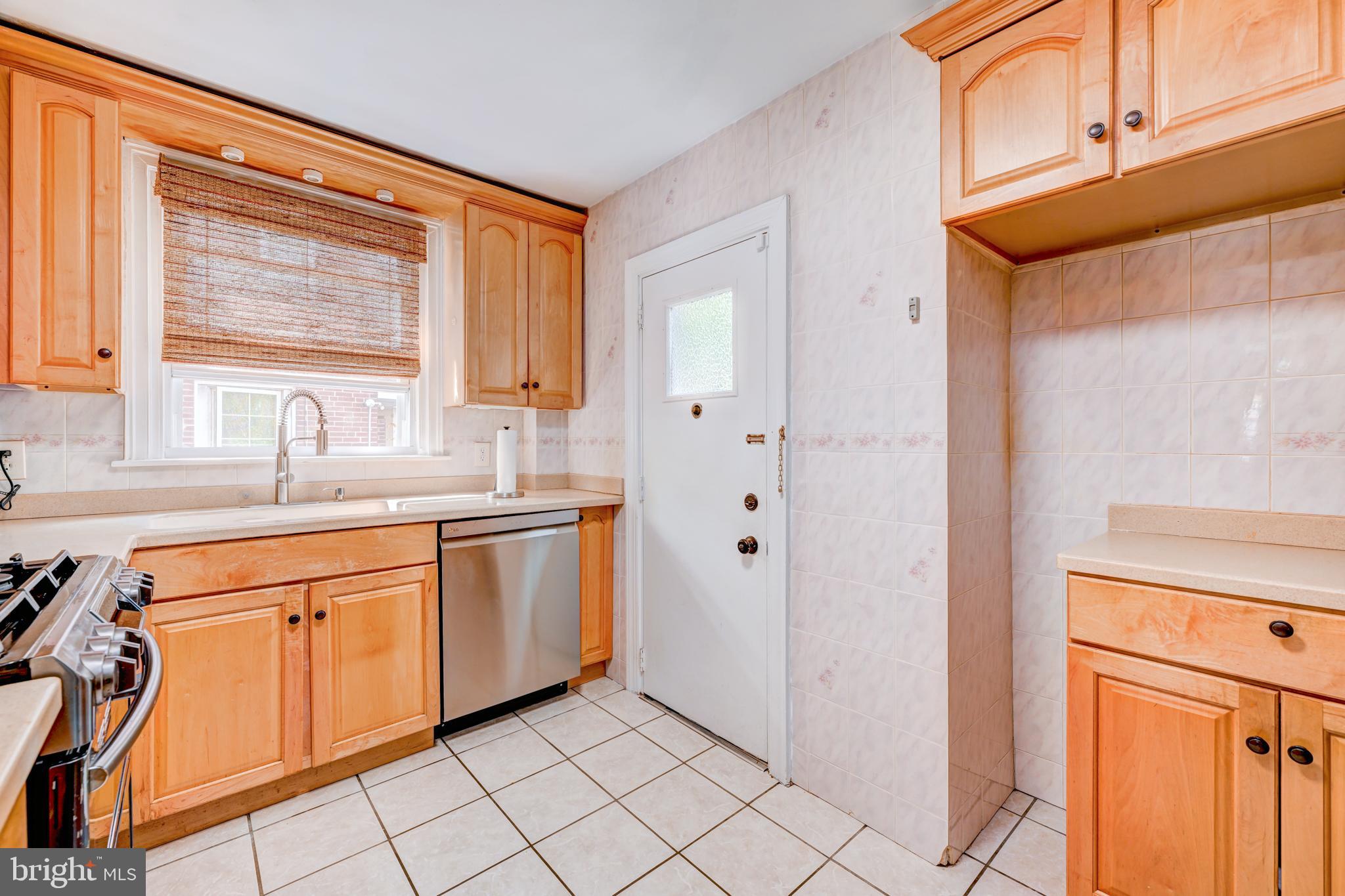 14 Summit Avenue Wyncote, PA 19095 - Photo 11 of 36 a kitchen with stainless steel appliances granite countertop a refrigerator and a sink