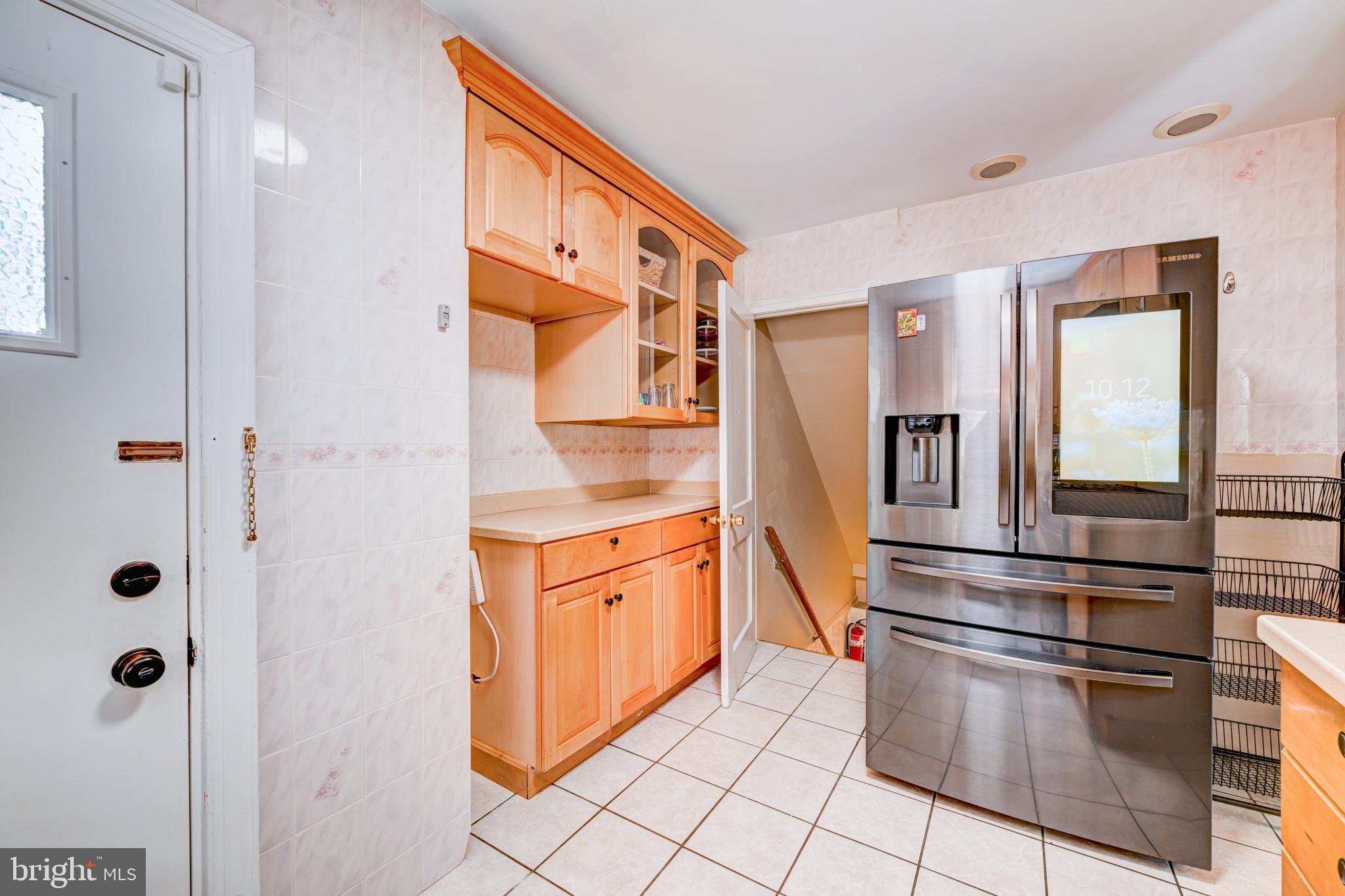 14 Summit Avenue Wyncote, PA 19095 - Photo 13 of 36 a kitchen with stainless steel appliances granite countertop a refrigerator and a sink