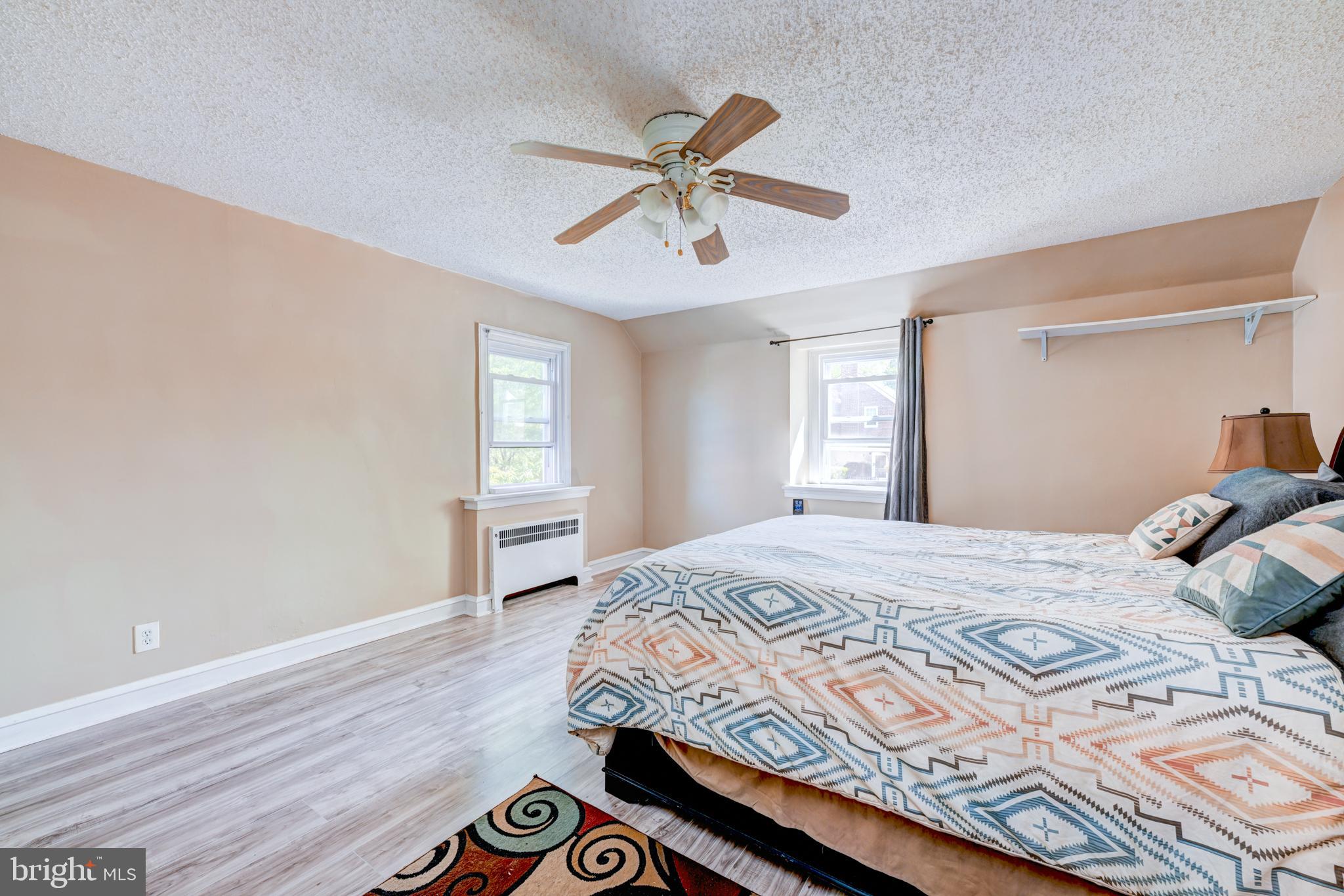 14 Summit Avenue Wyncote, PA 19095 - Photo 14 of 36 a bedroom with a large bed and a window