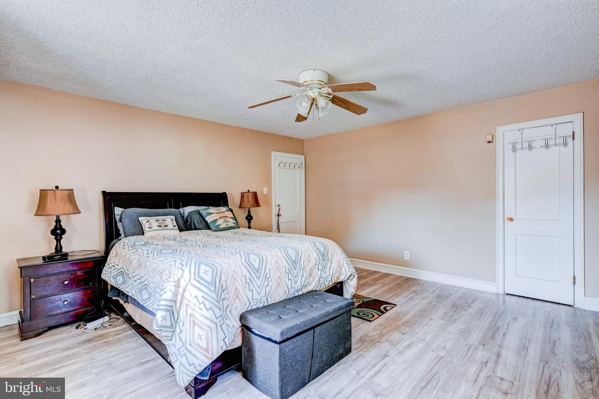 14 Summit Avenue Wyncote, PA 19095 - Photo 15 of 36 a bedroom with a bed and wooden floor