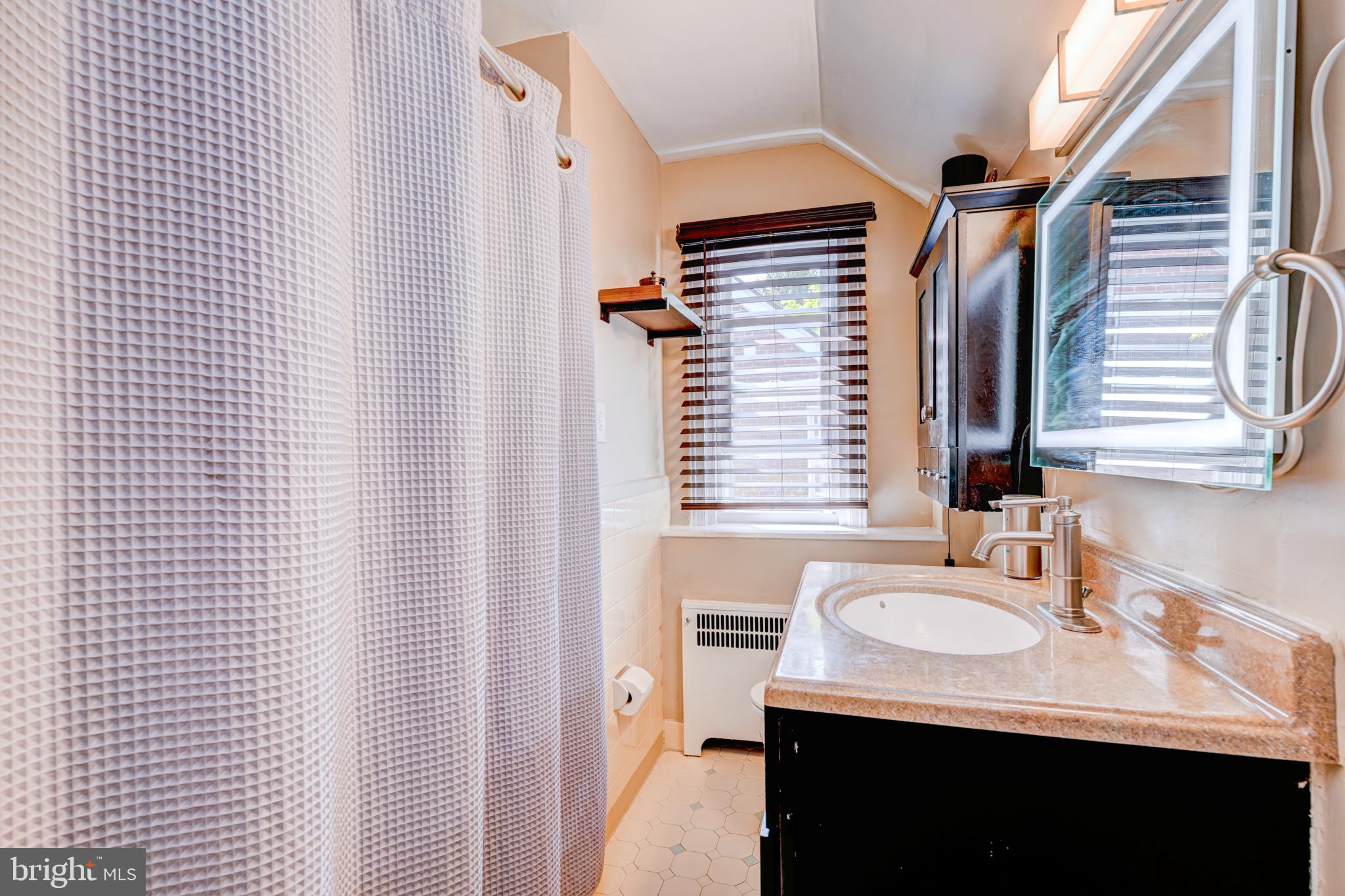 14 Summit Avenue Wyncote, PA 19095 - Photo 17 of 36 a bathroom with a sink and a mirror