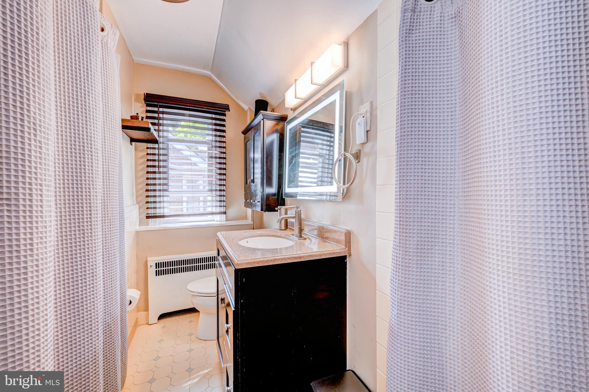 14 Summit Avenue Wyncote, PA 19095 - Photo 18 of 36 a bathroom with a sink and a mirror