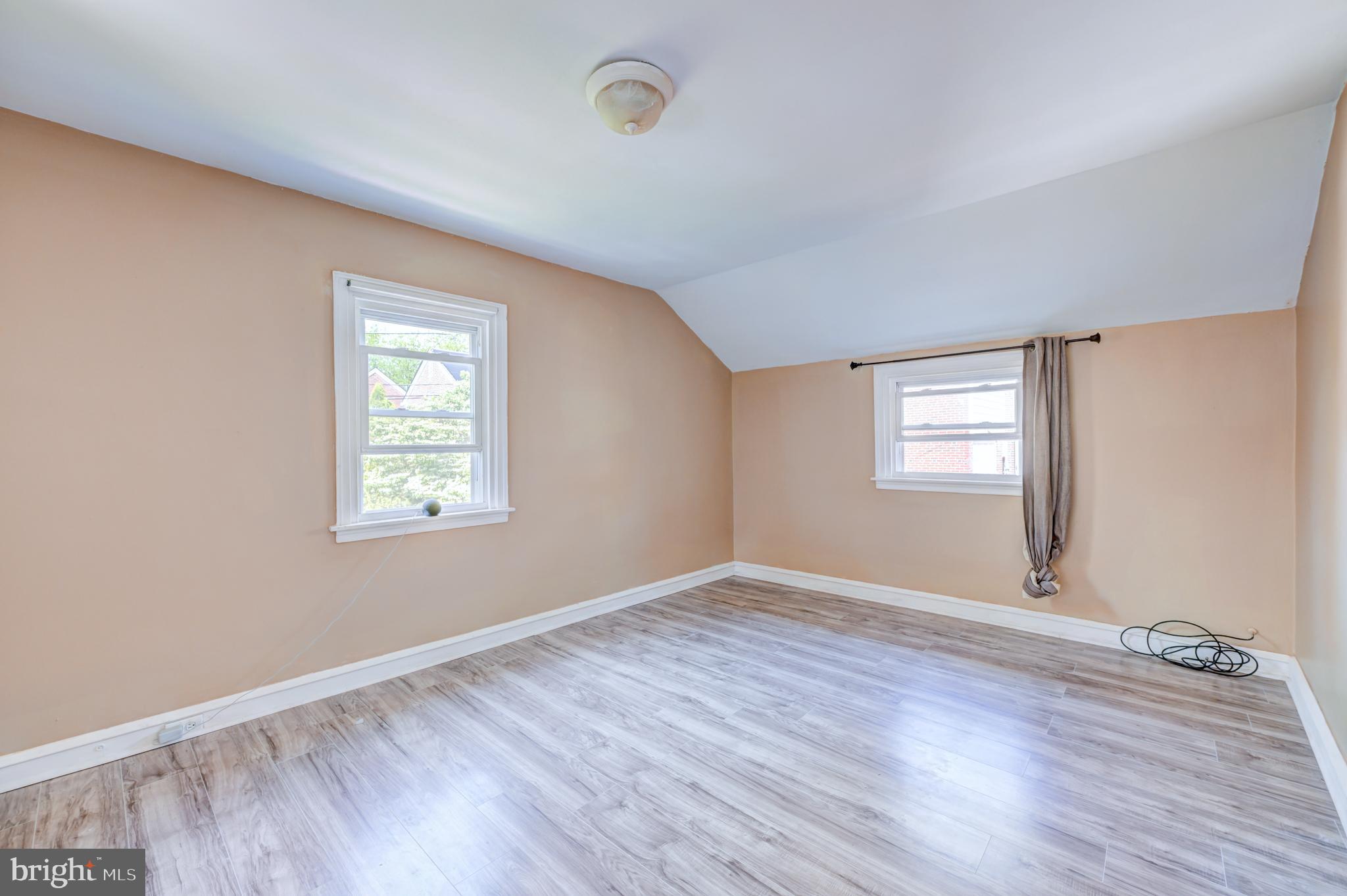14 Summit Avenue Wyncote, PA 19095 - Photo 19 of 36 an empty room with wooden floor and windows