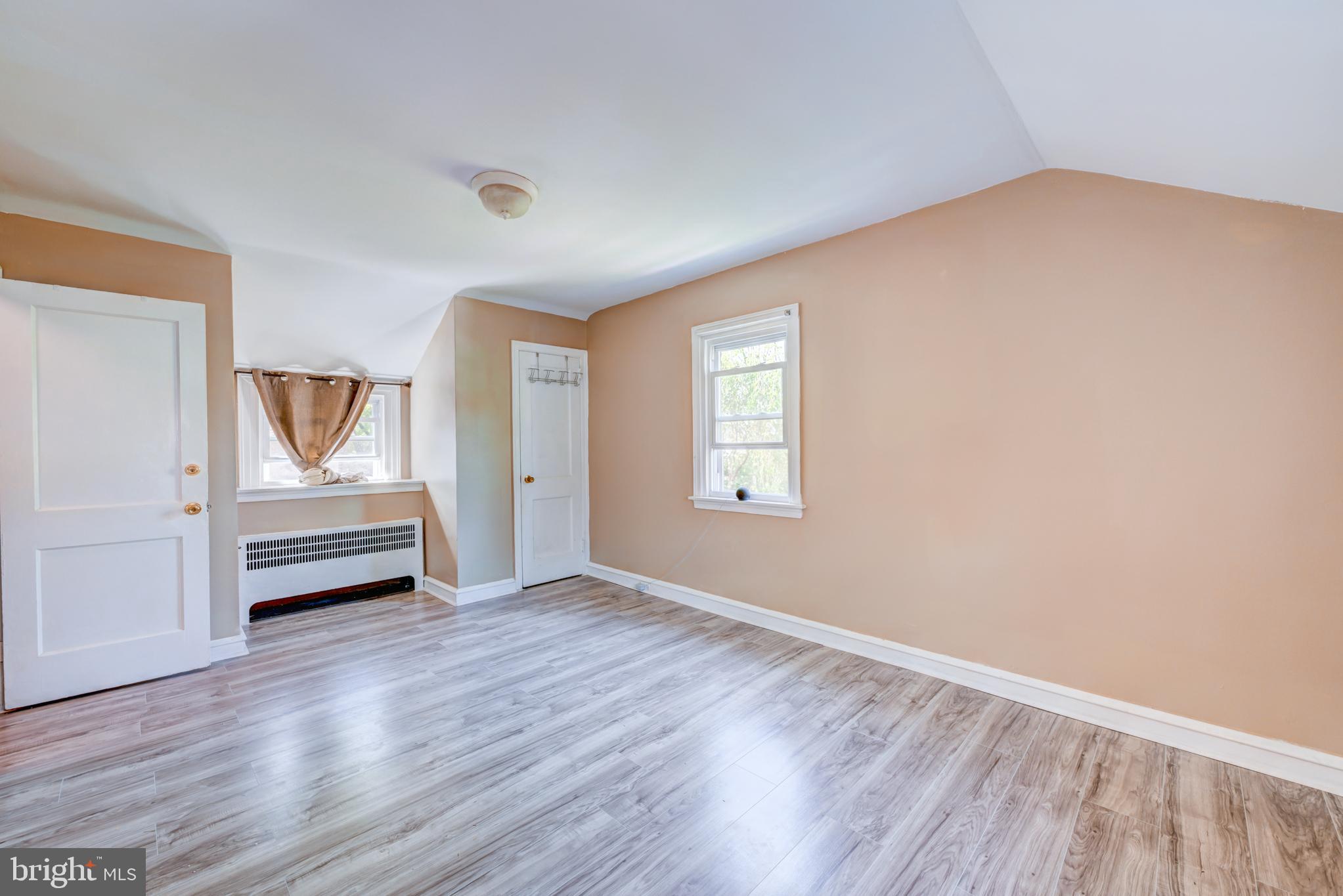 14 Summit Avenue Wyncote, PA 19095 - Photo 20 of 36 an empty room with wooden floor air conditioner and windows