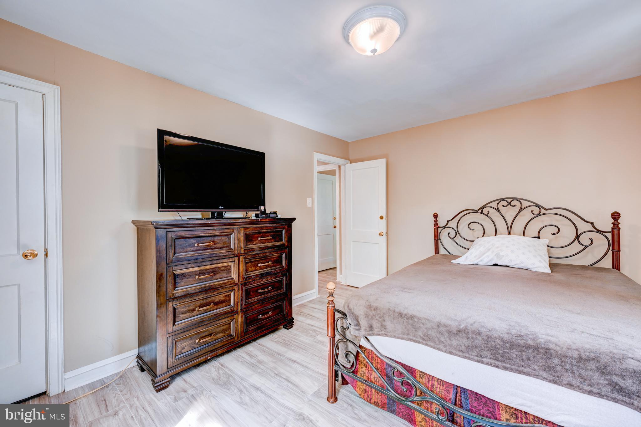 14 Summit Avenue Wyncote, PA 19095 - Photo 22 of 36 a bedroom with a bed and a flat screen tv