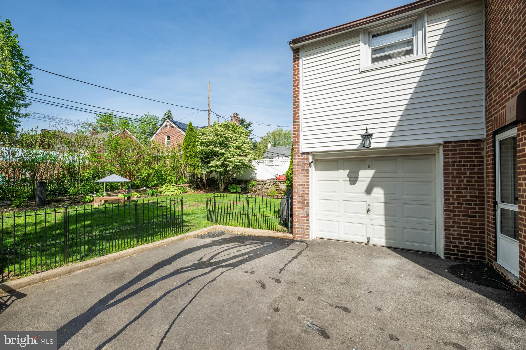 14 Summit Avenue Wyncote, PA 19095 - Photo 28 of 36 a front view of a house with a yard and garage