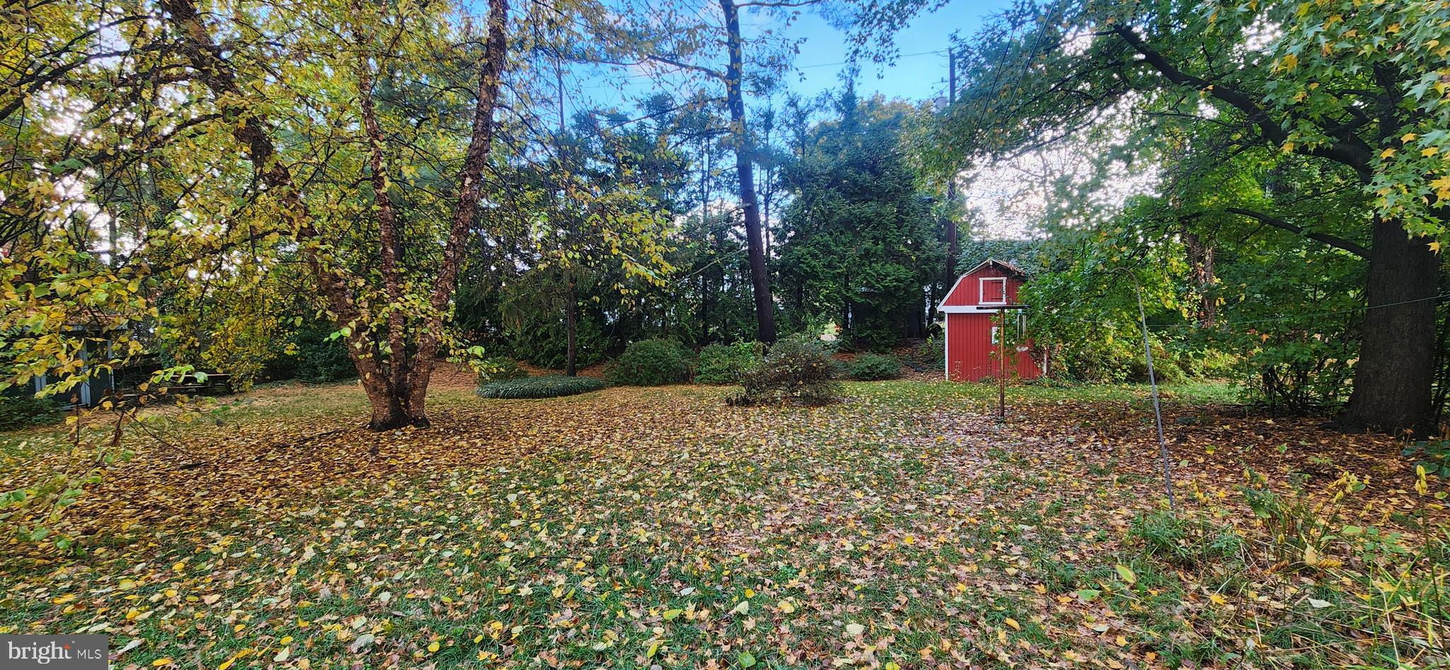 4846 Londonderry Road Harrisburg, PA 17109 - Photo 16 of 51 a flag is sitting in the middle of a forest
