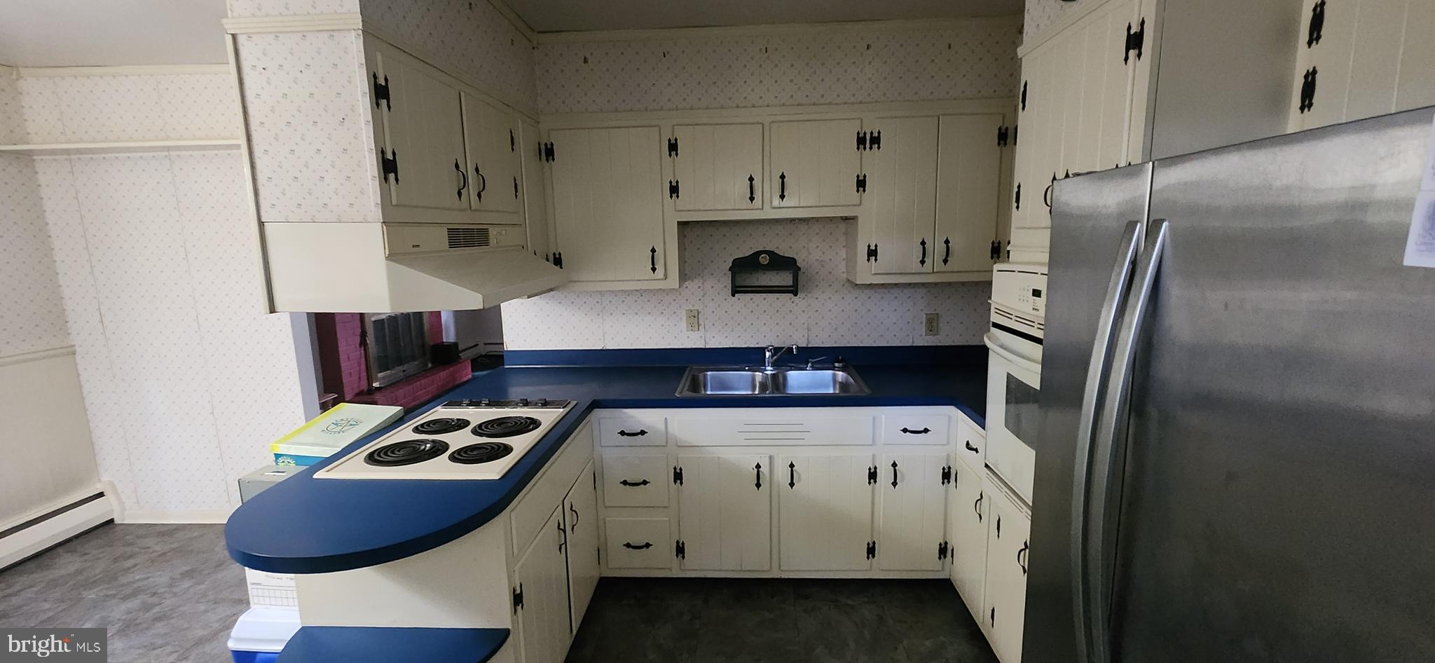 4846 Londonderry Road Harrisburg, PA 17109 - Photo 24 of 51 a kitchen with stainless steel appliances a stove a refrigerator and a fireplace