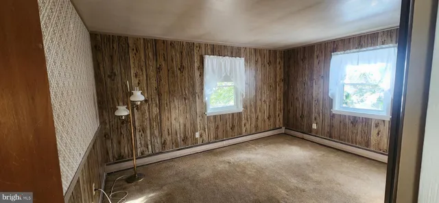 a view of entryway with a door and wooden floor