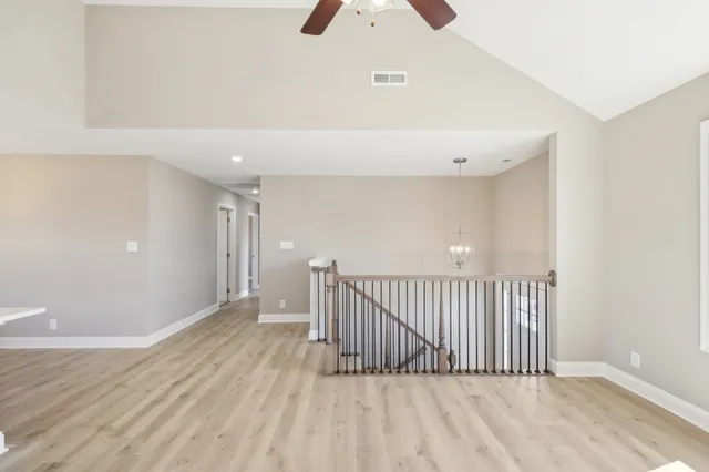 a view of a room with wooden floor