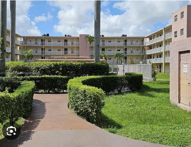 a view of a garden with a pathway