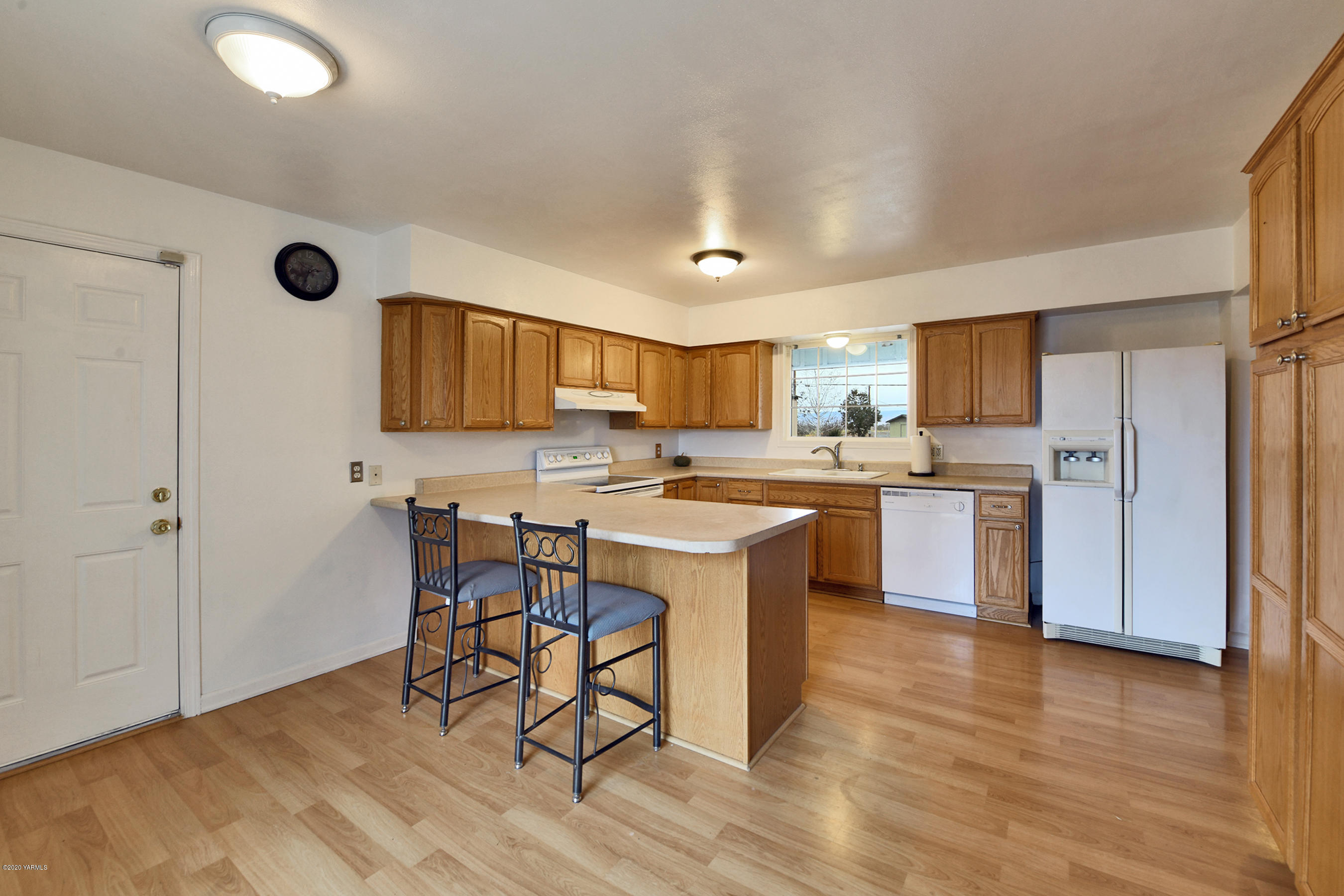 951 Batali Road Harrah, WA 98933 - Photo 8 of 22 a kitchen with a sink a counter top space cabinets and stainless steel appliances