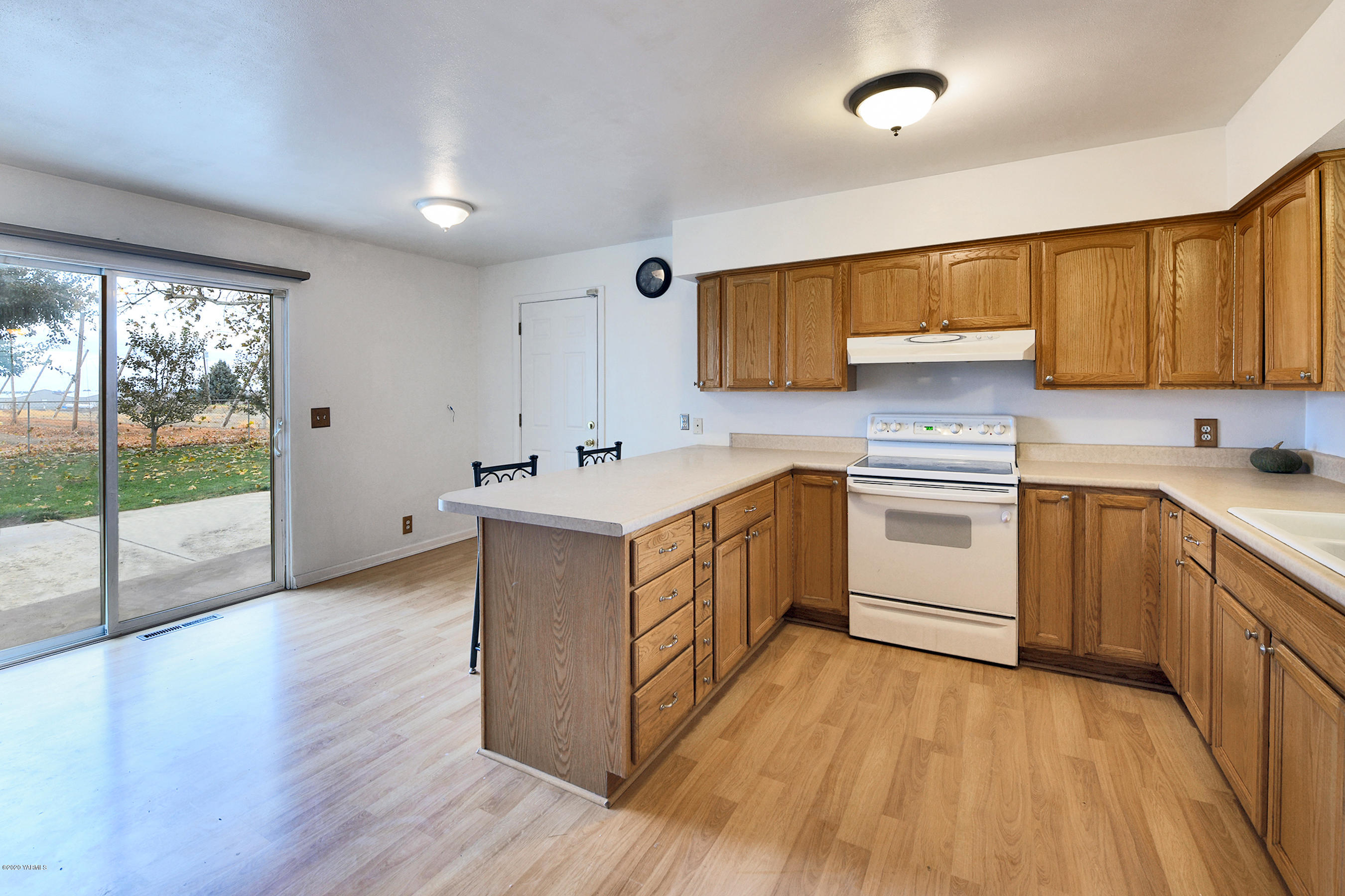 951 Batali Road Harrah, WA 98933 - Photo 9 of 22 a kitchen with a sink cabinets and wooden floor