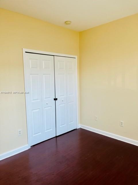 15655 Southwest 41st Street, Unit 201 Miramar, FL 33027 - Photo 11 of 18 an empty room with wooden floor