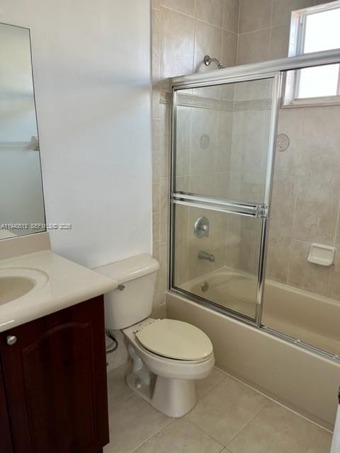 15655 Southwest 41st Street, Unit 201 Miramar, FL 33027 - Photo 12 of 18 a bathroom with a shower a toilet and a sink
