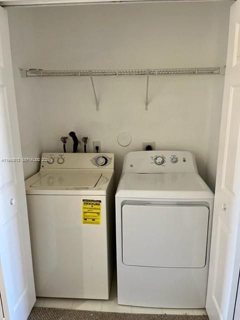 15655 Southwest 41st Street, Unit 201 Miramar, FL 33027 - Photo 13 of 18 a utility room with dryer and washer