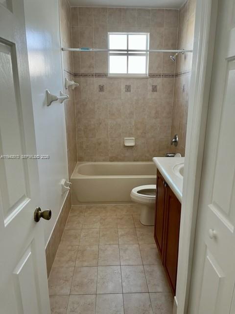 15655 Southwest 41st Street, Unit 201 Miramar, FL 33027 - Photo 15 of 18 a bathroom with a sink a toilet and shower