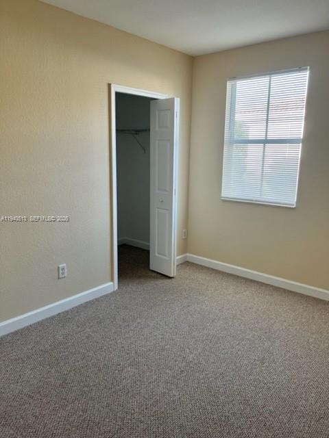 15655 Southwest 41st Street, Unit 201 Miramar, FL 33027 - Photo 16 of 18 an empty room with windows