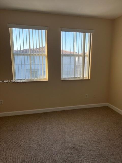 15655 Southwest 41st Street, Unit 201 Miramar, FL 33027 - Photo 18 of 18 an empty room with a window