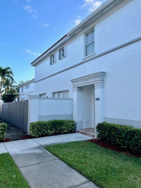 15655 Southwest 41st Street, Unit 201 Miramar, FL 33027 - Photo 4 of 18 a front view of a house with garden